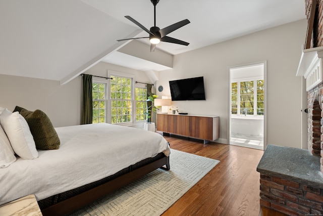99 Cross Hwy, Redding, CT 06896 - bedroom with a brick fireplace, vaulted ceiling, wood finished floors, and a ceiling fan