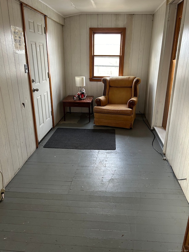 242 Madison St, Waterbury, CT 06706 - living area with hardwood / wood-style flooring and wooden walls