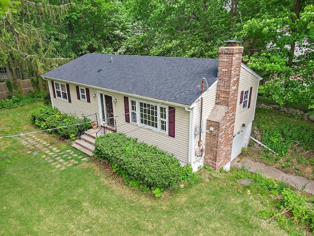 3 Pattagansett Ct, East Lyme, CT 06357 - view of front facade with a chimney, roof with shingles, a garage, and driveway