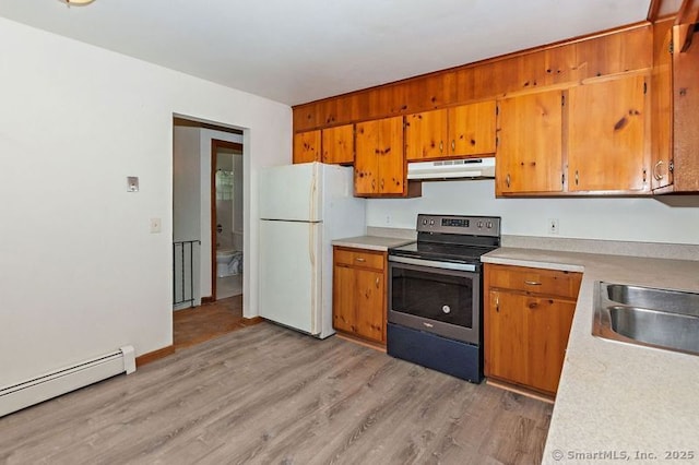 3 Pattagansett Ct, East Lyme, CT 06357 - kitchen with under cabinet range hood, stainless steel electric stove, freestanding refrigerator, a baseboard radiator, and light wood finished floors