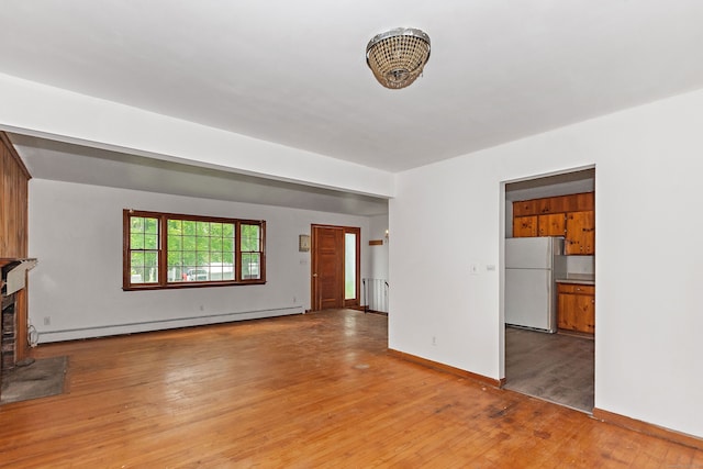 3 Pattagansett Ct, East Lyme, CT 06357 - unfurnished living room with baseboard heating, light wood-style floors, and baseboards