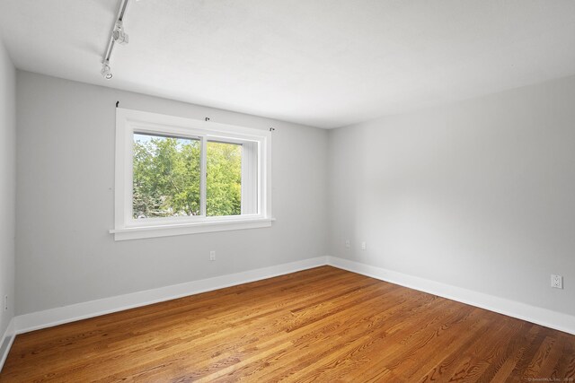 37 Topfield Rd, Wilton, CT 06897 - unfurnished room with wood finished floors, track lighting, and baseboards