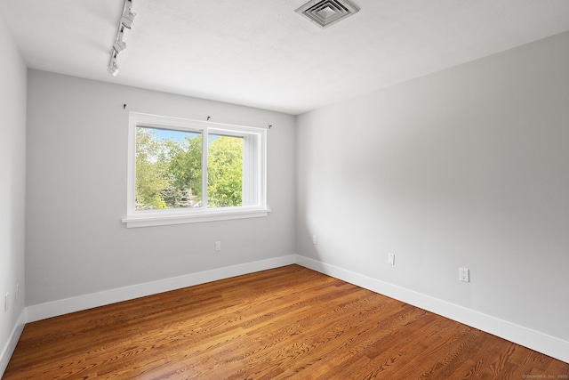37 Topfield Rd, Wilton, CT 06897 - spare room featuring track lighting, light wood-style floors, and baseboards