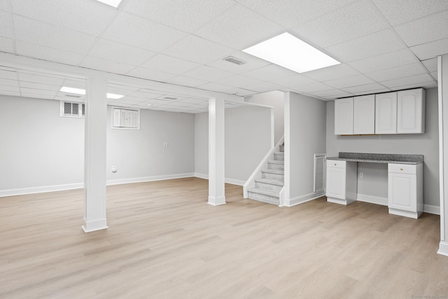 37 Topfield Rd, Wilton, CT 06897 - finished below grade area featuring light wood finished floors, stairs, a paneled ceiling, and baseboards