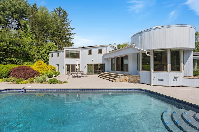 37 Topfield Rd, Wilton, CT 06897 - rear view of house with a patio area, an outdoor pool, and outdoor dining area