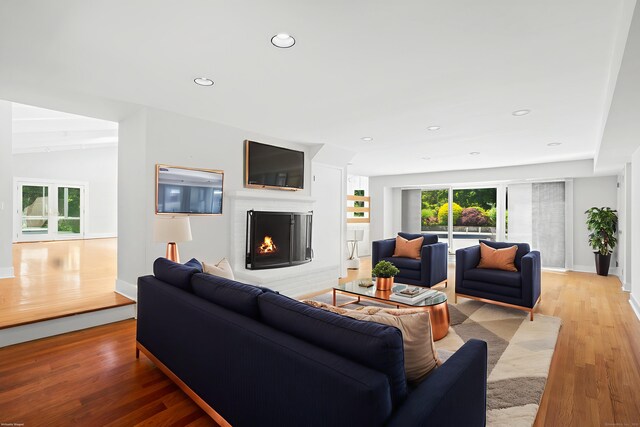 37 Topfield Rd, Wilton, CT 06897 - living area featuring a lit fireplace, light wood-style flooring, plenty of natural light, baseboards, and recessed lighting