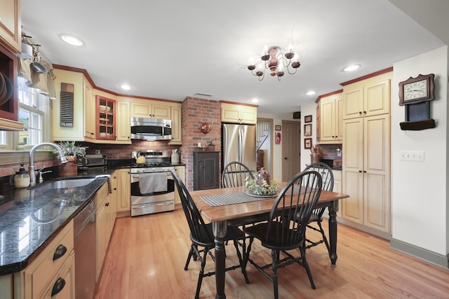 50 Clinton St, Glastonbury, CT 06033 - kitchen featuring appliances with stainless steel finishes, a sink, decorative backsplash, light wood-type flooring, and recessed lighting