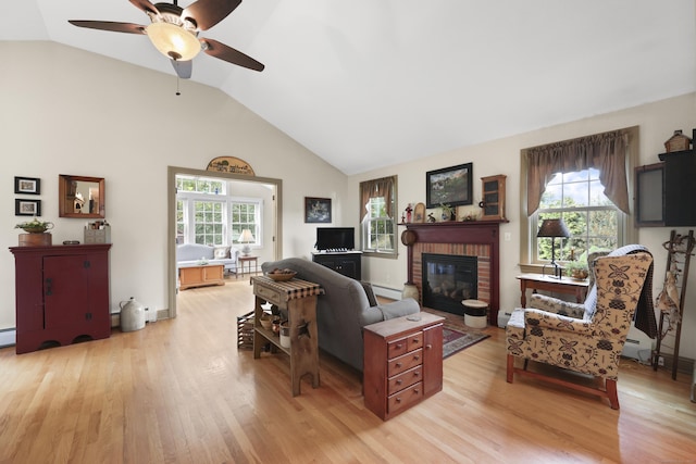 50 Clinton St, Glastonbury, CT 06033 - living area featuring light wood-style floors, ceiling fan, a fireplace, high vaulted ceiling, and a baseboard radiator