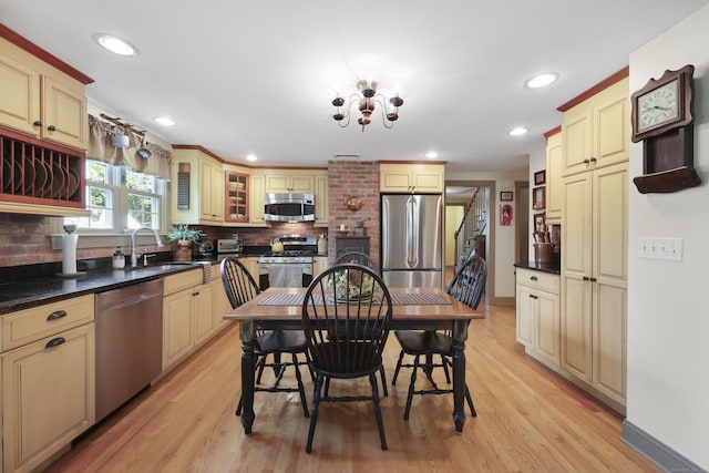 50 Clinton St, Glastonbury, CT 06033 - kitchen with appliances with stainless steel finishes, cream cabinets, tasteful backsplash, a sink, and recessed lighting