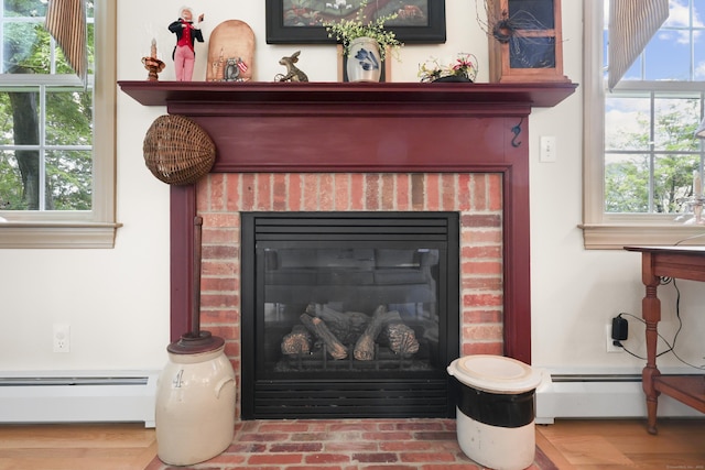50 Clinton St, Glastonbury, CT 06033 - detailed view of baseboard heating and a fireplace