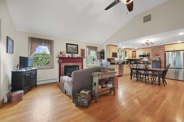 50 Clinton St, Glastonbury, CT 06033 - living room featuring a baseboard radiator, a ceiling fan, plenty of natural light, and high vaulted ceiling