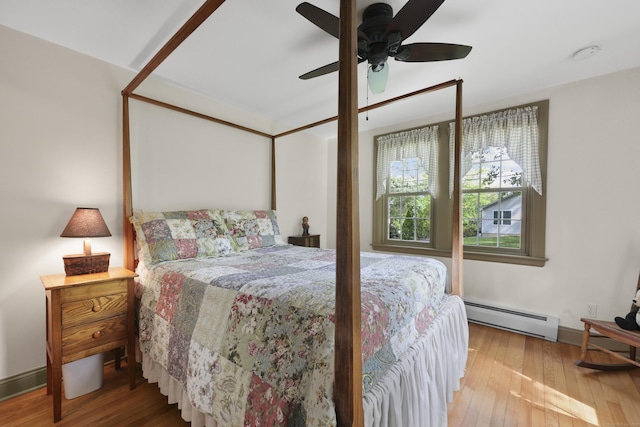 50 Clinton St, Glastonbury, CT 06033 - bedroom with a baseboard radiator, hardwood / wood-style floors, baseboards, and ceiling fan