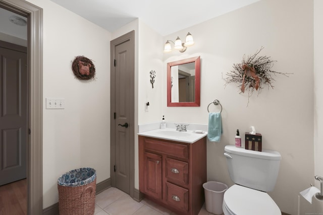 50 Clinton St, Glastonbury, CT 06033 - half bathroom featuring vanity, toilet, and tile patterned floors