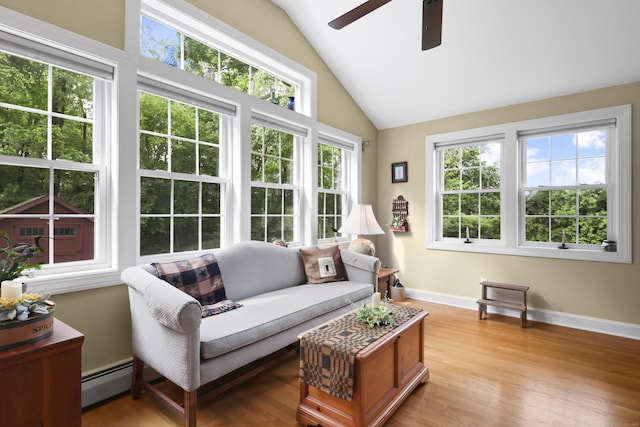 50 Clinton St, Glastonbury, CT 06033 - living room with vaulted ceiling, ceiling fan, healthy amount of natural light, baseboard heating, and light wood-style floors