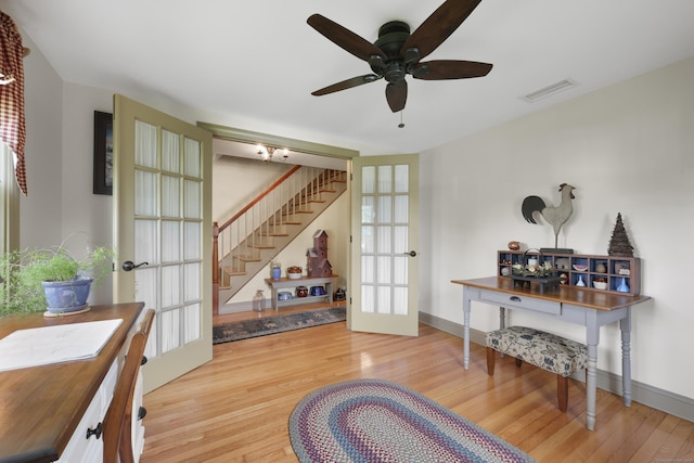 50 Clinton St, Glastonbury, CT 06033 - living area featuring french doors, stairs, wood finished floors, and a ceiling fan