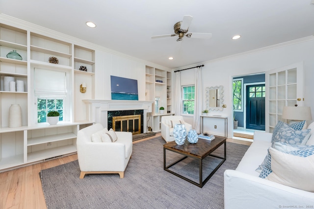 19 Bryan Rd, Norwalk, CT 06853 - living area with crown molding, wood finished floors, a ceiling fan, recessed lighting, and a fireplace