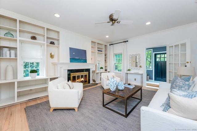 19 Bryan Rd, Norwalk, CT 06853 - living room with ornamental molding, wood finished floors, a ceiling fan, a high end fireplace, and recessed lighting