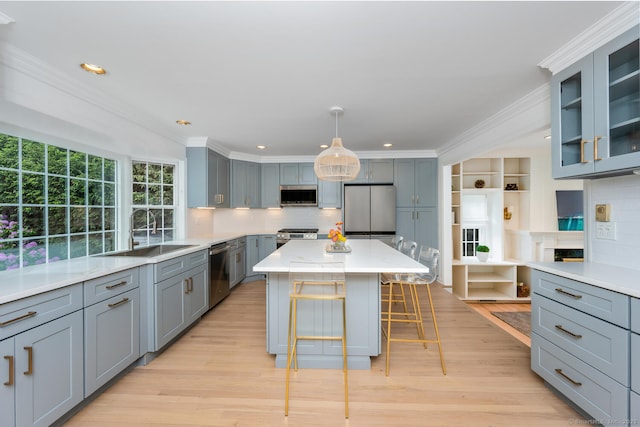 19 Bryan Rd, Norwalk, CT 06853 - kitchen featuring stainless steel appliances, a sink, ornamental molding, decorative backsplash, and gray cabinetry