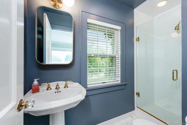 19 Bryan Rd, Norwalk, CT 06853 - bathroom with a stall shower, healthy amount of natural light, tile patterned flooring, and a sink