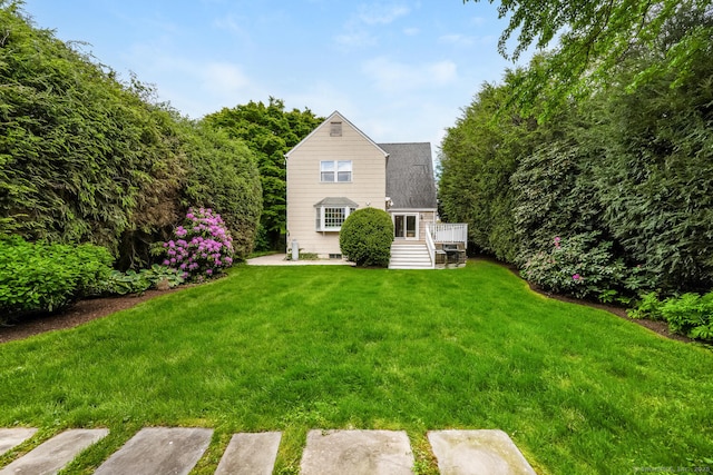 19 Bryan Rd, Norwalk, CT 06853 - back of property with a lawn and a deck
