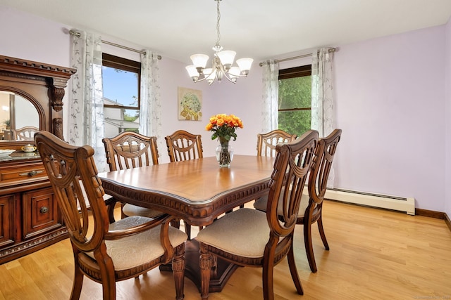 132 Royal Oak Dr, Southington, CT 06489 - dining space featuring a chandelier, baseboard heating, and light wood-type flooring