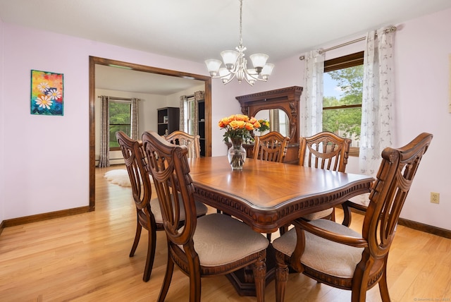 132 Royal Oak Dr, Southington, CT 06489 - dining area featuring a chandelier, healthy amount of natural light, light wood-type flooring, and baseboards