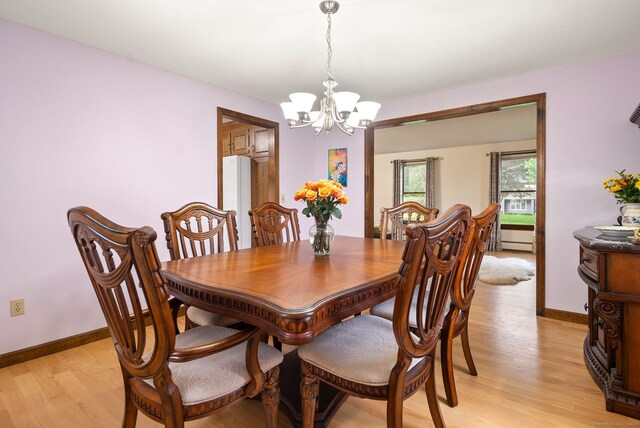 132 Royal Oak Dr, Southington, CT 06489 - dining room with a chandelier, light wood-type flooring, baseboard heating, and baseboards