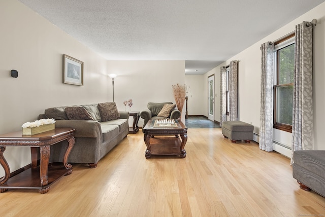 132 Royal Oak Dr, Southington, CT 06489 - living room featuring light wood-style flooring and a textured ceiling