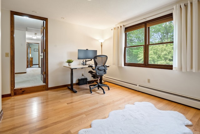 132 Royal Oak Dr, Southington, CT 06489 - home office featuring a baseboard heating unit, wood finished floors, and baseboards