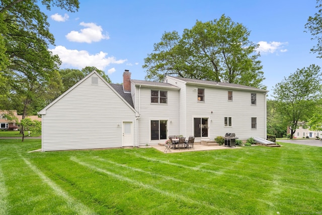 132 Royal Oak Dr, Southington, CT 06489 - back of property featuring a patio area, a chimney, and a lawn