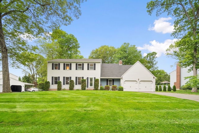 132 Royal Oak Dr, Southington, CT 06489 - colonial home featuring an attached garage, a front yard, driveway, and a chimney