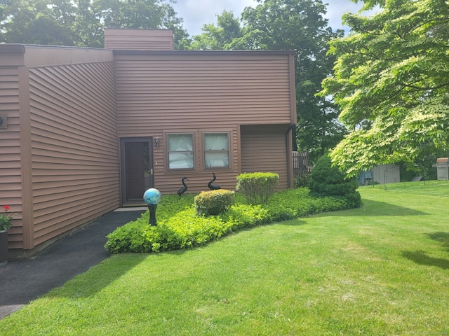 13 Little River Ln, Middletown, CT 06457 - view of front of property featuring a front lawn and a chimney