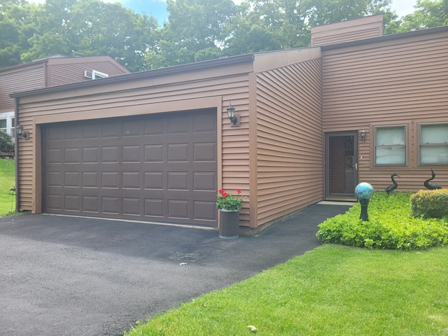 13 Little River Ln, Middletown, CT 06457 - view of front of property featuring a garage and asphalt driveway