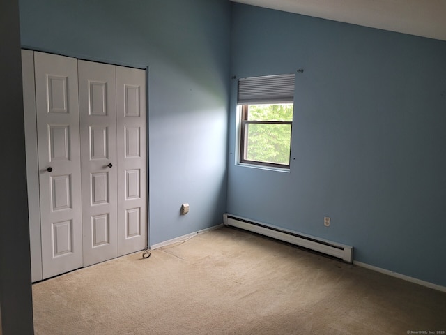 13 Little River Ln, Middletown, CT 06457 - unfurnished bedroom featuring baseboard heating, carpet floors, a closet, and baseboards