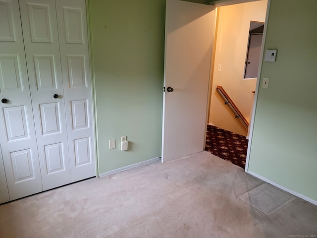 13 Little River Ln, Middletown, CT 06457 - unfurnished bedroom featuring carpet floors, a closet, and baseboards