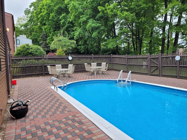 13 Little River Ln, Middletown, CT 06457 - view of swimming pool featuring outdoor dining space and a patio