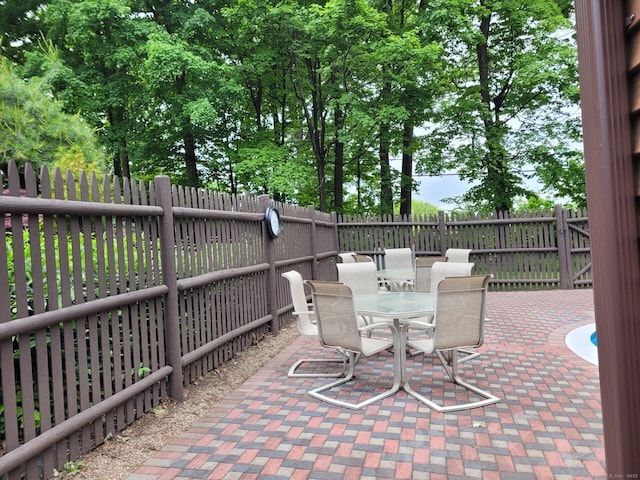 13 Little River Ln, Middletown, CT 06457 - fenced backyard with outdoor dining area and a patio area