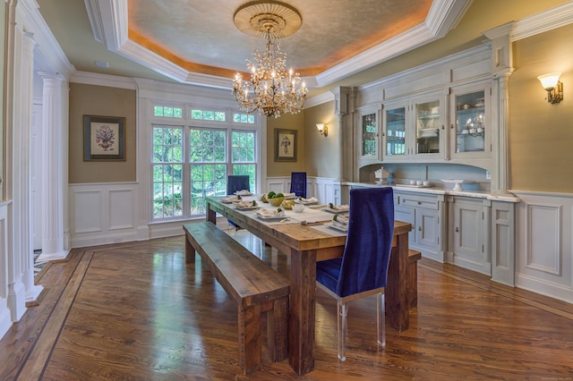 134 Nod Rd, Ridgefield, CT 06877 - dining room with a decorative wall, a tray ceiling, dark wood-style flooring, a chandelier, and crown molding