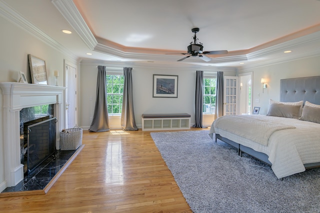 134 Nod Rd, Ridgefield, CT 06877 - bedroom with a tray ceiling, multiple windows, ornamental molding, a high end fireplace, and recessed lighting