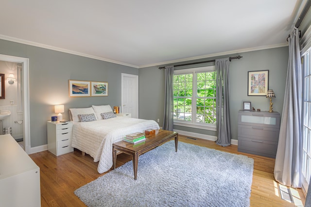134 Nod Rd, Ridgefield, CT 06877 - bedroom featuring wood finished floors, crown molding, baseboards, and ensuite bathroom