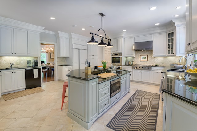 134 Nod Rd, Ridgefield, CT 06877 - kitchen featuring stainless steel appliances, a sink, under cabinet range hood, dark countertops, and white cabinets