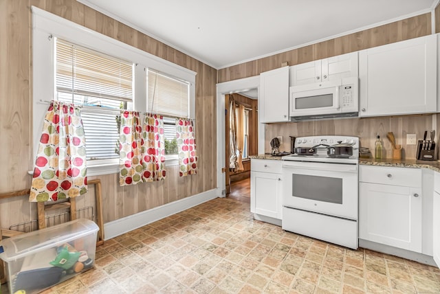 441 Savin Ave, West Haven, CT 06516 - kitchen with white appliances, wooden walls, white cabinets, baseboards, and ornamental molding