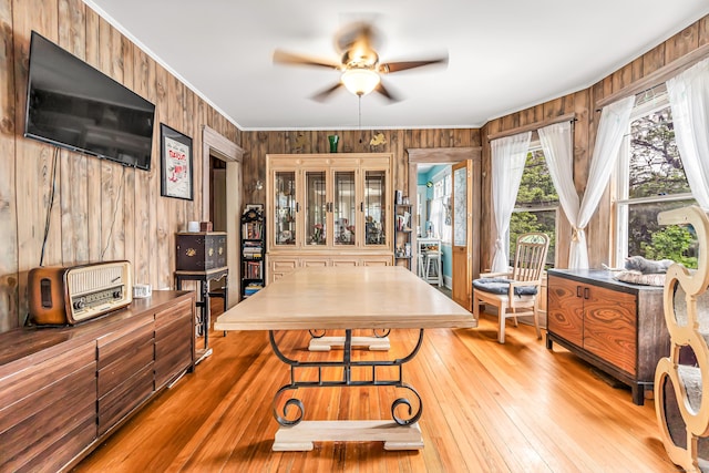 441 Savin Ave, West Haven, CT 06516 - dining area with a ceiling fan, ornamental molding, light wood finished floors, and wood walls