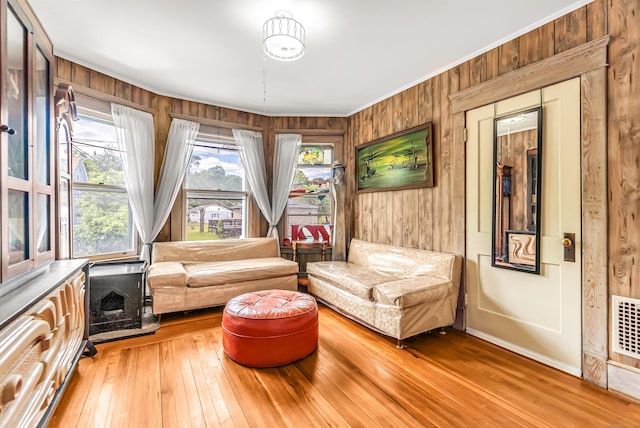 441 Savin Ave, West Haven, CT 06516 - living area with light wood-style flooring, wood walls, and baseboards