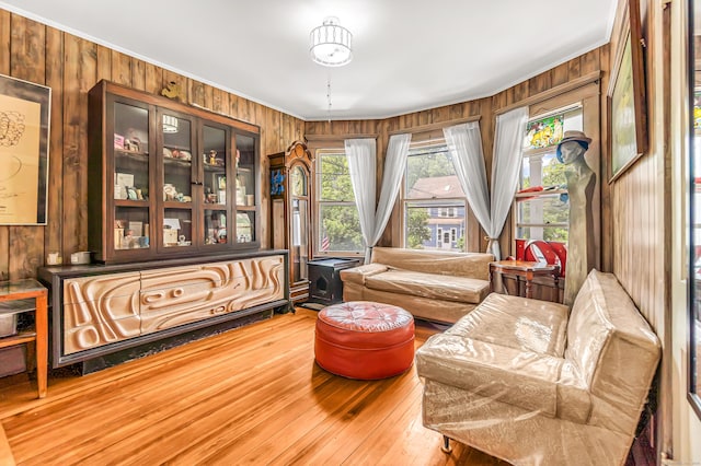 441 Savin Ave, West Haven, CT 06516 - living area featuring wooden walls, hardwood / wood-style flooring, and ornamental molding