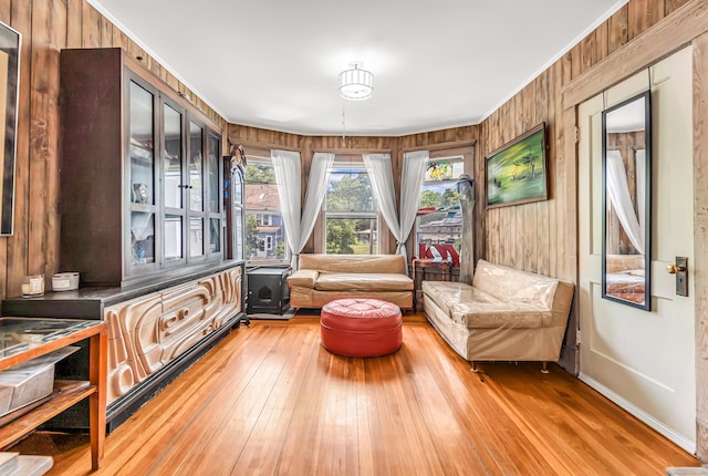 441 Savin Ave, West Haven, CT 06516 - living area featuring light wood-type flooring, ornamental molding, and wooden walls