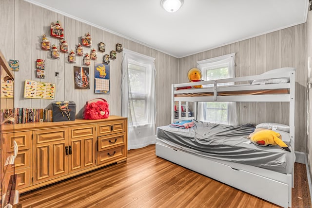 441 Savin Ave, West Haven, CT 06516 - bedroom with light wood-style flooring, crown molding, and wood walls