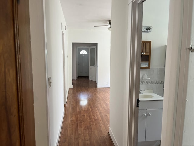 47 Beacon St, Hamden, CT 06514 - corridor with dark wood-style floors, a sink, and baseboards