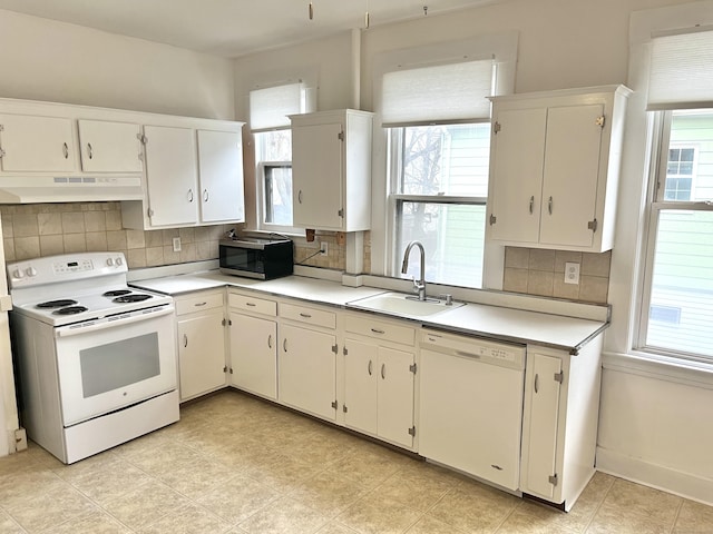 47 Beacon St, Hamden, CT 06514 - kitchen with white appliances, under cabinet range hood, a sink, and plenty of natural light