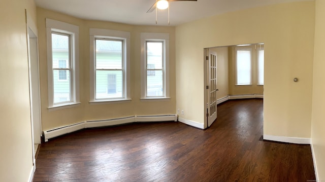 47 Beacon St, Hamden, CT 06514 - spare room featuring a baseboard heating unit, ceiling fan, dark wood-type flooring, and healthy amount of natural light
